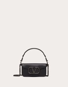 Valentino Garavani Locò small shoulder bag in calfskin with metallic VLogo Signature detail. Equipped with both a detachable sliding chain strap and a detachable handle, this accessory can be worn as a crossbody/shoulder bag or carried as a handbag. - Tone-on-tone-finish hardware - Magnetic closure - Removable leather handle - Shoulder strap with removable sliding chain - Nappa leather lining. Interior: one slip pocket - Shoulder strap drop length: 55 cm / 21.7 in. - Dimensions: W20xH11xD5 cm / Studded Sneakers, Oxford Boots, Small Shoulder Bag, Boots For Sale, Bag For Women, Small Leather Goods, Sneakers For Sale, Valentino Garavani, Crossbody Shoulder Bag