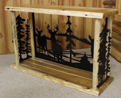 the silhouettes of deer and trees are on display in this wooden frame with instructions