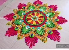 colorful rangdi work on the floor for diwaling