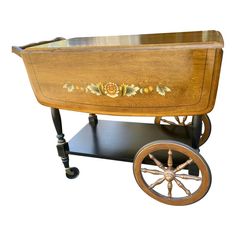 an old fashioned wooden wagon with wheels