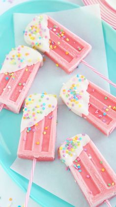 pink and white ice cream popsicles with sprinkles