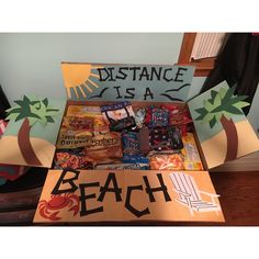 a cardboard box filled with assorted candy and candies that reads distance is a beach