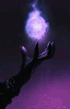 a hand reaching up towards a purple light