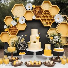 a table topped with cakes and desserts covered in honeycombs