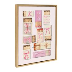 a wooden frame with matches and bows on it