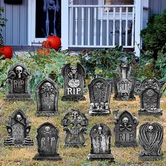 a bunch of tombstones that are sitting in the grass