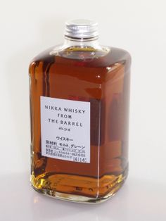 a bottle of nikka whisky from the barrel on a white surface with japanese writing