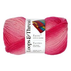 a skein of yarn with pink and red colors