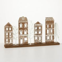 a group of wooden houses sitting on top of a table