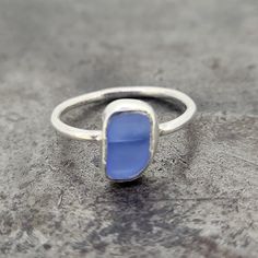 Sterling silver handmade and one of a kind ring with a bezel set light blur genuine piece of sesglass . Finger size 7.5 Silver Recycled Glass Ring, Diy Silver Rings, Silversmith Rings, Silver Rings With Stones, How To Make Rings, Diy Rings, Handmade Rings, Sea Glass Jewelry, Jewelry Inspo