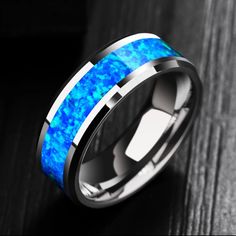 a ring with blue opal inlays on it