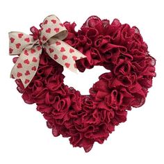 a red heart shaped wreath with hearts on the front and bow tie around it's neck