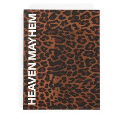 a brown and black leopard print book with the words heaven written in white on it