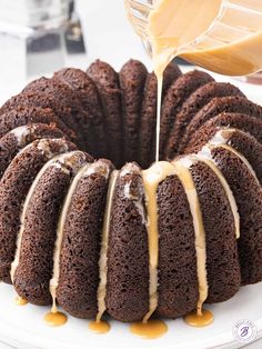 a bundt cake with icing being drizzled over it