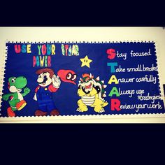 a bulletin board is decorated with mario and other cartoon characters, including toad, yoshi