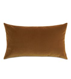 a brown pillow on a white background