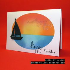 a happy birthday card with a sailboat on the water in front of an orange background