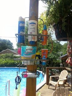 there are many items on the pole by the pool