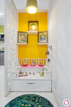 a bathroom with yellow walls and white furniture in the corner, along with an area rug on the floor