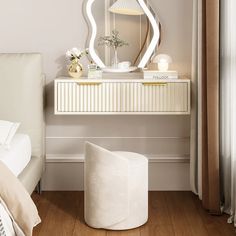 a bedroom with white furniture and a large mirror on the wall above it's headboard