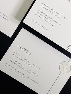 the wedding stationery is laid out on top of each other