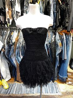 ♥ D E S C R I P T I O N ♥ Adorable vintage 1980's black ruffle dotted tulle mini dress. Features a bow trimmed sweetheart neckline, with ruching along the bust and low waist, and a tiered ruffle skirt.  ♥ S I Z E & M E A S U R E M E N T S ♥ Length: 27.5 in Bust: 15 in Waist: 13 in Hips: 19 in Labeled size 8 Fits size small ♥ Authenticity Guarantee ♥ All items sold in our shop are 100% guaranteed authentic or your money back. Homecoming Dress 2000s, Coquette Mini Dress With Ruffles For Evening, Vintage Ruffled Mini Dress For Party, Vintage Mini Dress With Ruffles For Party, Vintage Ruffle Mini Dress For Party, Low Waist Dress, Dress Up Wardrobe, Goth Fits, Applique Jacket