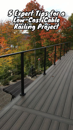 a wooden deck with black railings and trees in the background text reads 3 expert tips for a low - costable railing project