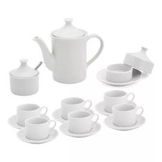 a white tea set with cups and saucers