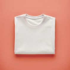 Mockup of White Folded T shirt on Plain Peach Background Digital File Download. Plain Peach Background, Plain White T Shirt, Peach Background, Tshirt Mockup, Shirt Mockup, White Tshirt, Digital Files, Mockup, Printed Items