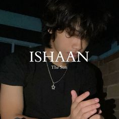 a young man with his hands folded in front of him and the words ishaan on it