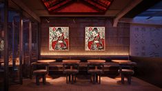 a dimly lit restaurant with two paintings on the wall and four stools in front of them