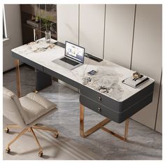 an office desk with a laptop on it