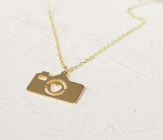 14k Solid Gold Tiny Camera Charm Necklace with Heart, Minimalist Photographer Jewelry, Dainty Camera Pendant, Christmas Gift for Traveler ♡ PRODUCT FEATURES ♡  * Material Selection: Sterling Silver, 14K Solid Gol * Color Selection: Yellow Gold, White Gold, Rose Gold * Necklace Lengths: 14 inches, 16 inches, 18 inches, 20 inches * Pendant Size: 8x12 mm * In addition to 14" -16" - 18" necklace lengths, it is possible to add +3 cm to silver products. (as adjustable)  ♡ OTHER ∙ FEATURES ✓ Anti-aller Camera Pendant, Heart Minimalist, Camera Charm, Tiny Camera, Gift For Traveler, Necklace With Heart, Diamond Choker Necklace, Material Selection, Diamond Choker