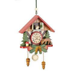 a cuckoo clock hanging from the side of a wall