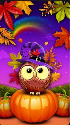 an owl wearing a witches hat sitting on top of a pumpkin with autumn leaves around it