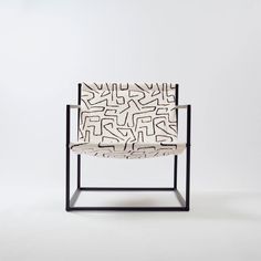 a chair with a black frame and white fabric