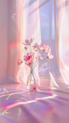 a vase filled with pink flowers sitting on top of a window sill next to a curtain