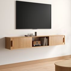 a flat screen tv mounted to the side of a wall