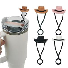 three different colored hats are attached to the side of a coffee cup