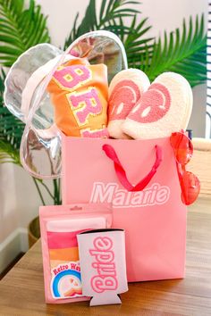 a pink bag filled with candy and other items