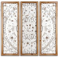 three panels with an intricate design on the front and back side, each paneled in wood