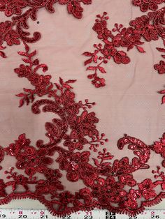 red lace fabric with flowers and sequins