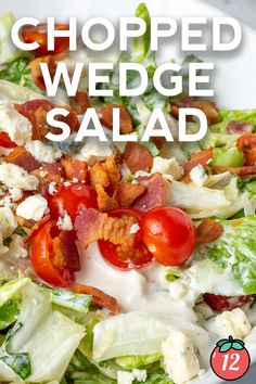 a salad with bacon, lettuce and tomatoes on it in a white bowl