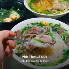 two bowls of pho thin lo noodle soup with meat and veggies