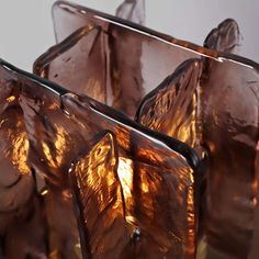 three glass vases sitting next to each other