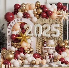 balloons and decorations are arranged on the mantle for a new year's eve celebration