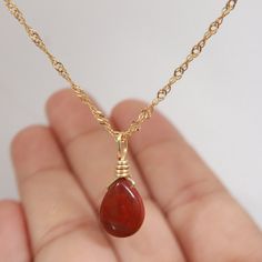 Introducing our stunning, handcrafted Red Jasper necklace with Pyrite accents, set in 18K Gold Filled chain. This exquisite piece of jewelry showcases the natural beauty and vibrant hues of Red Jasper, complemented by the sparkling Pyrite. Its unique and eye-catching design makes it the perfect accessory for any outfit, adding a touch of elegance and sophistication. Red Jasper is known for its grounding and stabilizing properties, while Pyrite is believed to promote prosperity and success. Toget Red Jasper Pendant, Glowup Plan, Red Jasper Jewelry, Red Jasper Necklace, Red Crystal Necklace, Necklace Elegant, Wrapped Necklace, Healing Crystal Jewelry, Jewelry Showcases