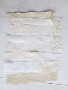 several pieces of white fabric on top of each other