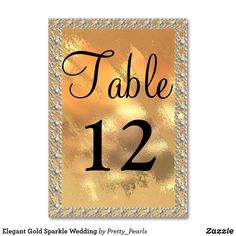 a table number card with gold foil on it