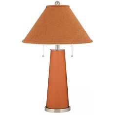 an orange table lamp with a brown shade on the top and silver trim around the base